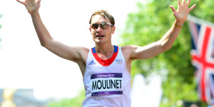 France's Bertrand Moulinet reacts as he crosses the finish line after competing in the London 2012 Olympic Games Men's 50km race walk in central London on August 11, 2012. AFP PHOTO / FRANCK FIFE